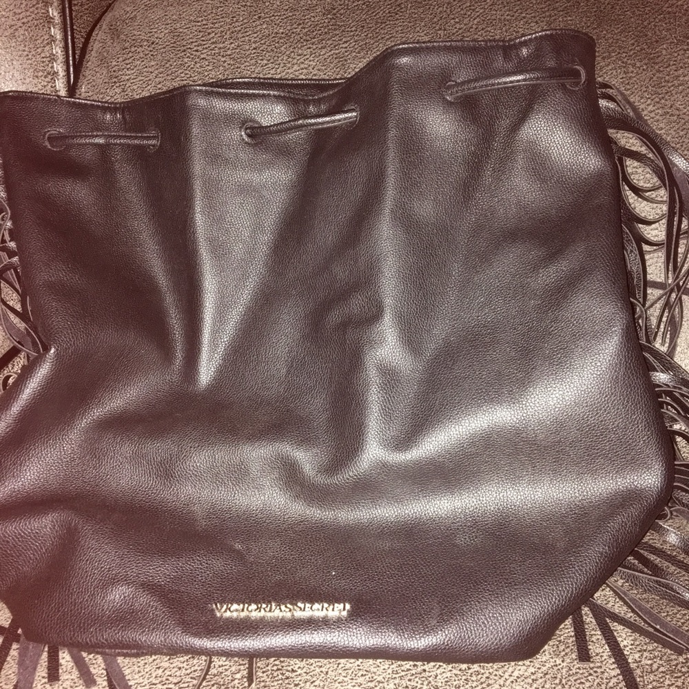 Black Victoria’s Secret purse with fringe.